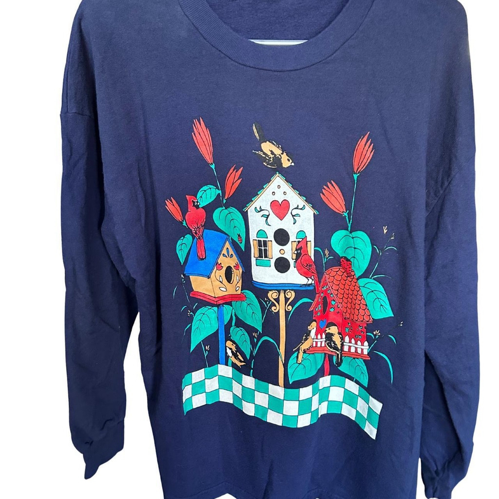 Blue light crewneck with a cute birdhouse design